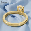 Back view of a 1.5 carat pear cut lab-grown diamond solitaire engagement ring in 18kt yellow gold