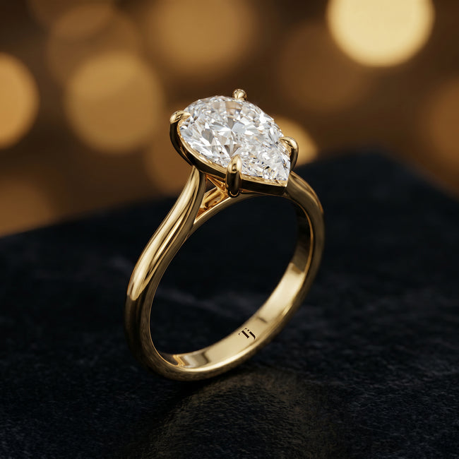 4-Claw Pear Cut Solitaire Diamond Ring - Yellow Gold