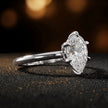 Angled side view of a 1.5 carat pear cut diamond solitaire engagement ring in an 18kt white gold 6 claw setting by TJ Diamond