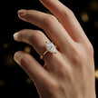 1.5 carat pear cut diamond solitaire engagement ring in an 18kt yellow gold 6 claw setting worn on a hand, by TJ Diamond