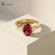 Front view of a pear cut lab-created ruby trilogy engagement ring in 18kt yellow gold with pear cut lab-grown diamond side stones.