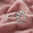 Side profile of an Oval Lab-Created Pink Diamond Halo Ring in 18kt white gold showcasing the elevated oval halo setting.