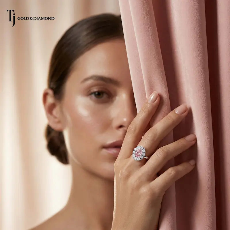 Model wearing an Oval Lab-Created Pink Diamond Halo Ring handcrafted in polished 18kt white gold with a brilliant diamond halo.