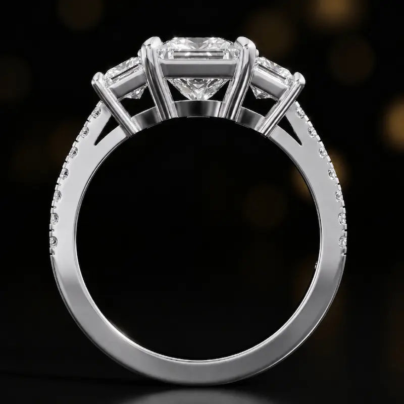 Front-on view of a princess cut three-stone lab-grown diamond engagement ring in 18kt white gold showing the setting profile