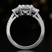 Front-on view of a princess cut three-stone lab-grown diamond engagement ring in 18kt white gold showing the setting profile