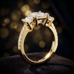 Angled view of a princess cut three-stone lab-grown diamond engagement ring in 18kt yellow gold with diamond shoulders