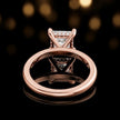 Back view of 4-claw princess cut engagement ring with hidden halo in 18kt rose gold