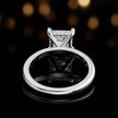 Back view of 4-claw princess cut engagement ring with hidden halo in 18kt white gold