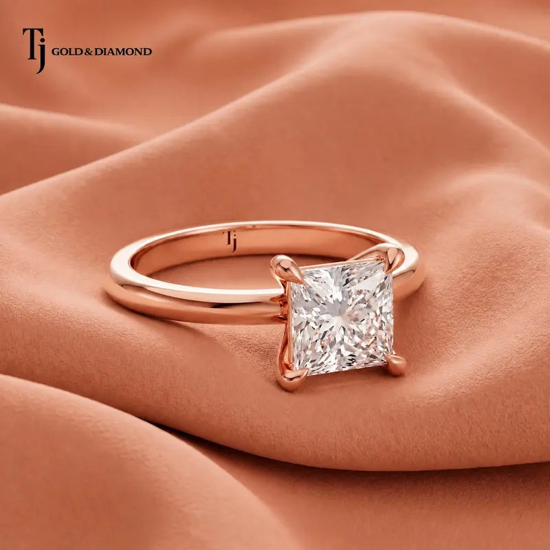 Front view of a 1.5 carat princess cut lab-grown diamond solitaire engagement ring in 18kt rose gold with a 4-claw setting