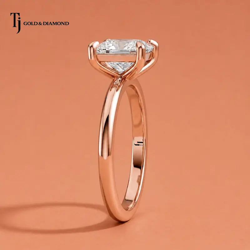 Side profile of a 1.5 carat princess cut 4-claw solitaire engagement ring in 18kt rose gold