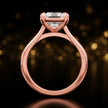 Front-on view of a 1.5 carat princess cut diamond solitaire engagement ring showing the full 18kt rose gold band and 4 claw cathedral setting by TJ Diamond