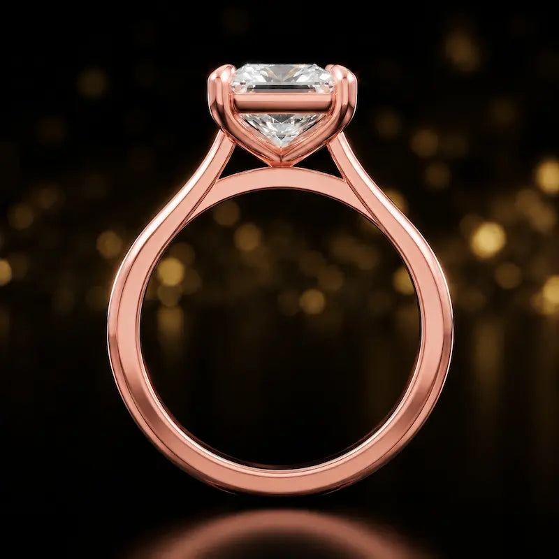 Front-on view of a 1.5 carat princess cut diamond solitaire engagement ring showing the full 18kt rose gold band and 4 claw cathedral setting by TJ Diamond