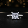 Front view of a 1.5 carat princess cut diamond solitaire engagement ring in an 18kt white gold 4 claw setting by TJ Diamond