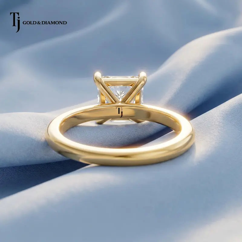 Back view of a 1.5 carat princess cut lab-grown diamond solitaire engagement ring in 18kt yellow gold