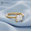 Front view of a 1.5 carat princess cut lab-grown diamond solitaire engagement ring in 18kt yellow gold with a 4-claw setting
