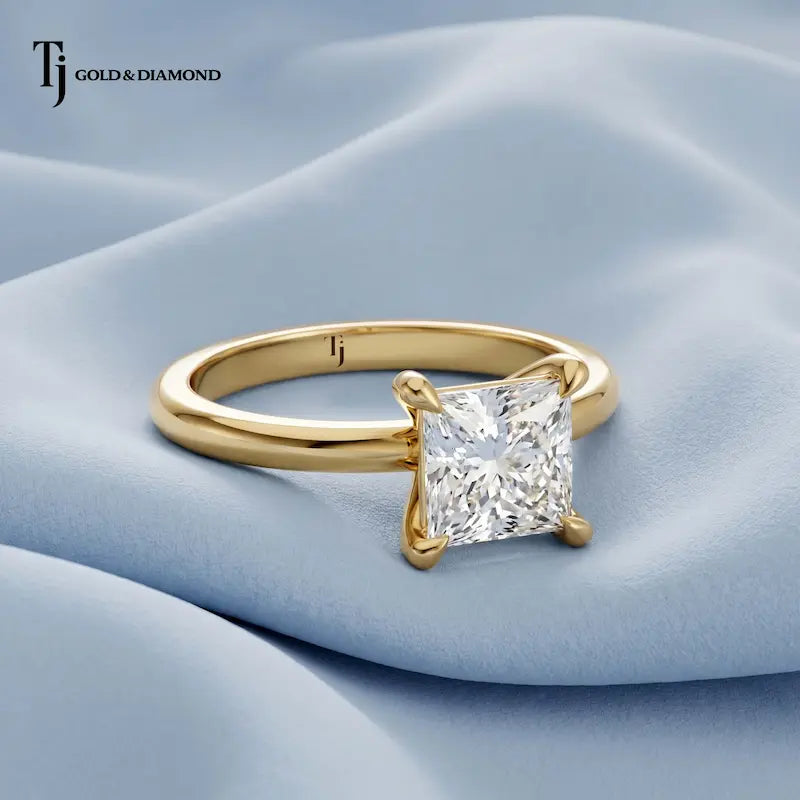Front view of a 1.5 carat princess cut lab-grown diamond solitaire engagement ring in 18kt yellow gold with a 4-claw setting