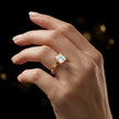 1.5 carat princess cut diamond solitaire engagement ring in an 18kt yellow gold 4 claw setting worn on a hand, by TJ Diamond