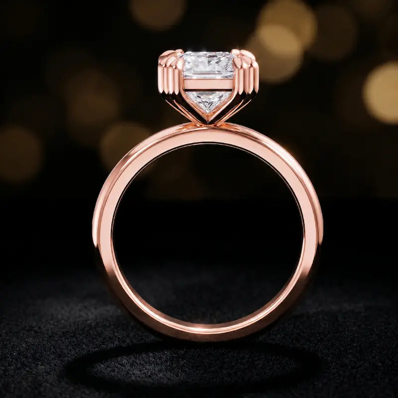 Front-on view of a 1.5 carat princess cut diamond solitaire engagement ring showing the full 18kt rose gold band and 4 double claw setting by TJ Diamond