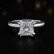 Front view of a 1.5 carat princess cut diamond solitaire engagement ring in an 18kt white gold 4 double claw setting by TJ Diamond