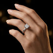 1.5 carat princess cut diamond solitaire engagement ring in an 18kt white gold 4 double claw setting worn on a hand, by TJ Diamond