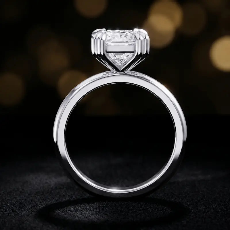 Front-on view of a 1.5 carat princess cut diamond solitaire engagement ring showing the full 18kt white gold band and 4 double claw setting by TJ Diamond