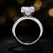 Front-on view of a 1.5 carat princess cut diamond solitaire engagement ring showing the full 18kt white gold band and 4 double claw setting by TJ Diamond