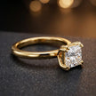Angled side view of a 1.5 carat princess cut diamond solitaire engagement ring in an 18kt yellow gold 4 double claw setting by TJ Diamond