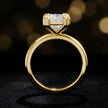 Front-on view of a 1.5 carat princess cut diamond solitaire engagement ring showing the full 18kt yellow gold band and 4 double claw setting by TJ Diamond