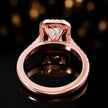 Rear view of an emerald cut halo lab-grown diamond engagement ring in 18kt rose gold.