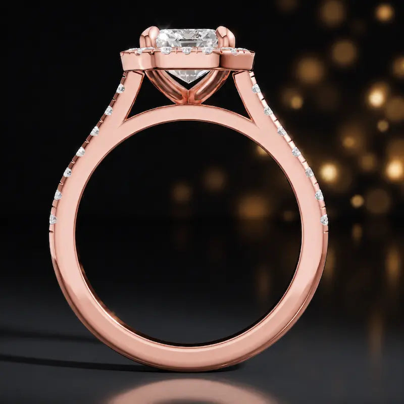 Side view of an emerald cut halo lab-grown diamond engagement ring in 18kt rose gold.