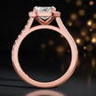 Side view of an emerald cut halo lab-grown diamond engagement ring in 18kt rose gold.