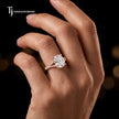 Cushion cut split shank lab-grown diamond engagement ring worn on hand in 18kt rose gold.