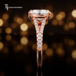 Side profile of a cushion cut split shank lab-grown diamond engagement ring with diamond-set shoulders in 18kt rose gold.