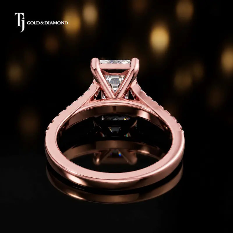 Back view of an emerald cut split shank lab-grown diamond engagement ring in 18kt rose gold.