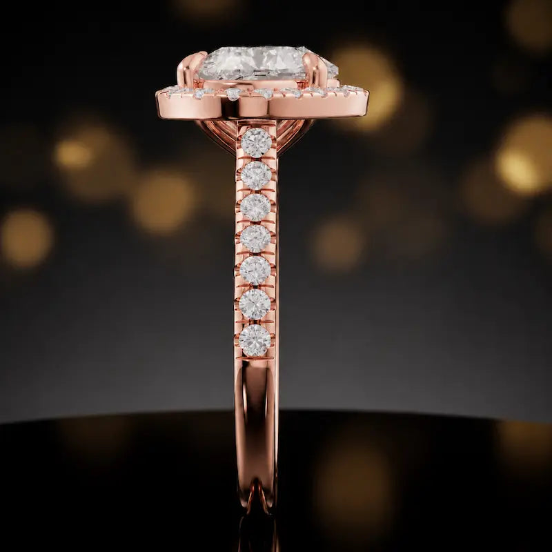 Side profile of a heart cut halo lab-grown diamond engagement ring in 18kt rose gold.