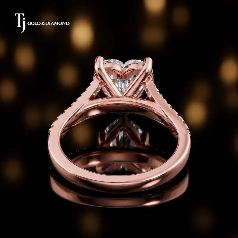 Back view of a heart cut split shank lab-grown diamond engagement ring in 18kt rose gold.