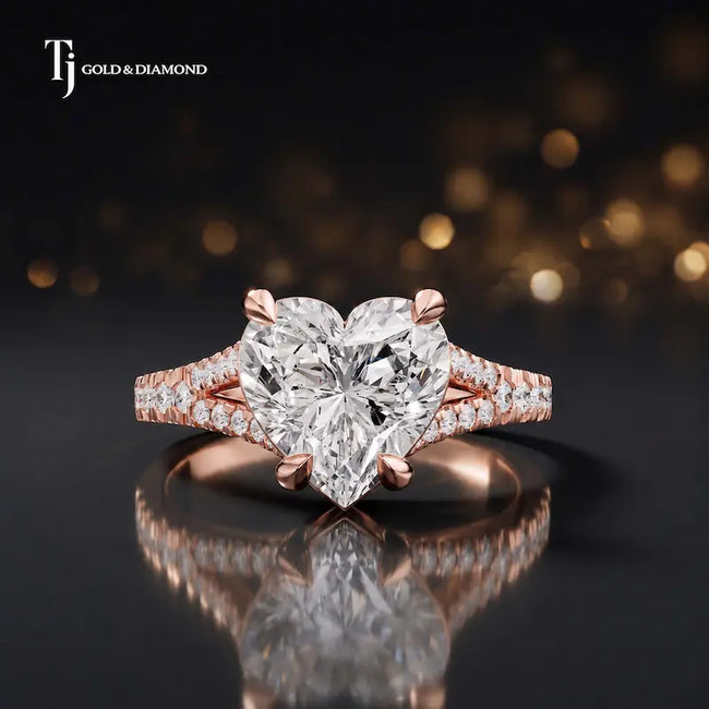 Front view of a heart cut split shank lab-grown diamond engagement ring in 18kt rose gold.