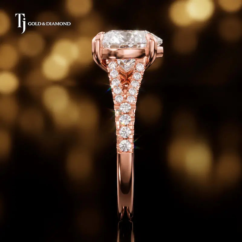 Side profile of a heart cut split shank lab-grown diamond engagement ring with diamond-set shoulders in 18kt rose gold.