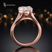 Side view of a heart cut split shank lab-grown diamond engagement ring featuring a four-claw cathedral setting in 18kt rose gold.