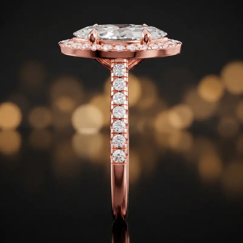 Side profile of a marquise cut halo lab-grown diamond engagement ring in 18kt rose gold.