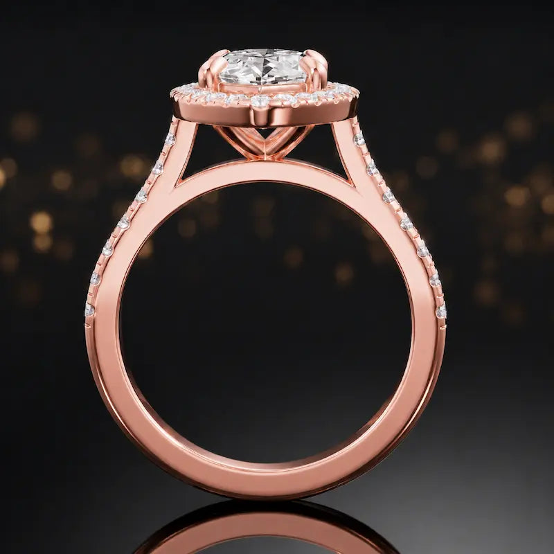 Side view of a marquise cut halo lab-grown diamond engagement ring with diamond-set shoulders in 18kt rose gold.
