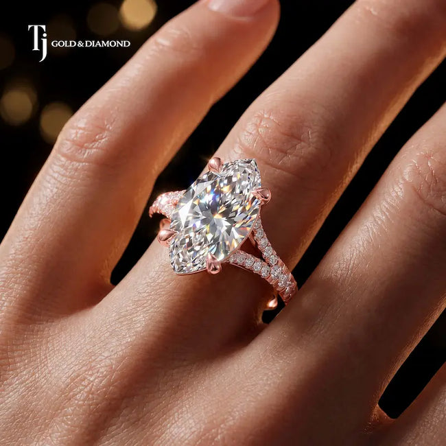 Marquise cut split shank lab-grown diamond engagement ring worn on hand in 18kt rose gold.
