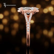 Side profile of a marquise cut split shank lab-grown diamond engagement ring with diamond-set shoulders in 18kt rose gold.