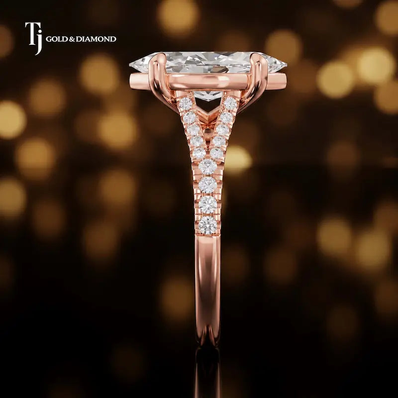 Side profile of a marquise cut split shank lab-grown diamond engagement ring with diamond-set shoulders in 18kt rose gold.