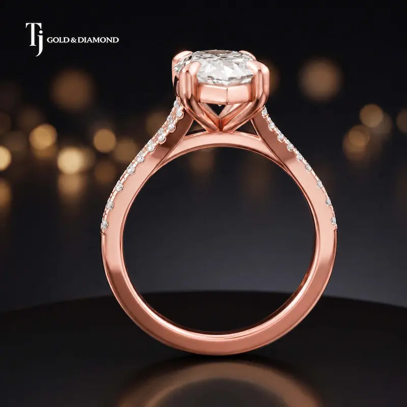 Side view of a marquise cut split shank lab-grown diamond engagement ring featuring a four-claw cathedral setting in 18kt rose gold.
