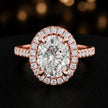 Front view of an oval cut halo lab-grown diamond engagement ring in 18kt rose gold.
