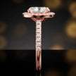 Side profile of an oval cut halo lab-grown diamond engagement ring in 18kt rose gold.