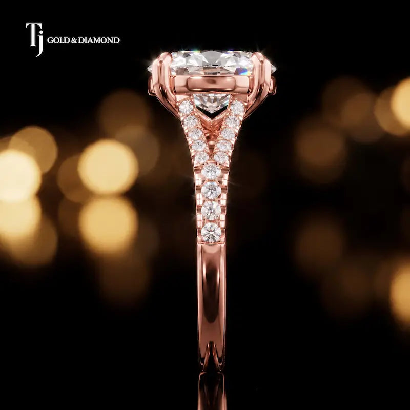 Side profile of an oval cut split shank lab-grown diamond engagement ring with diamond-set shoulders in 18kt rose gold.