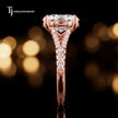 Side profile of an oval cut split shank lab-grown diamond engagement ring with diamond-set shoulders in 18kt rose gold.