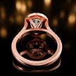 Rear view of a pear cut halo lab-grown diamond engagement ring in 18kt rose gold.